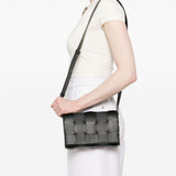Close-up of Bottega Veneta shoulder bags hardware and fine stitching