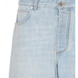 Close-up of Bottega Veneta pants hardware and fine stitching